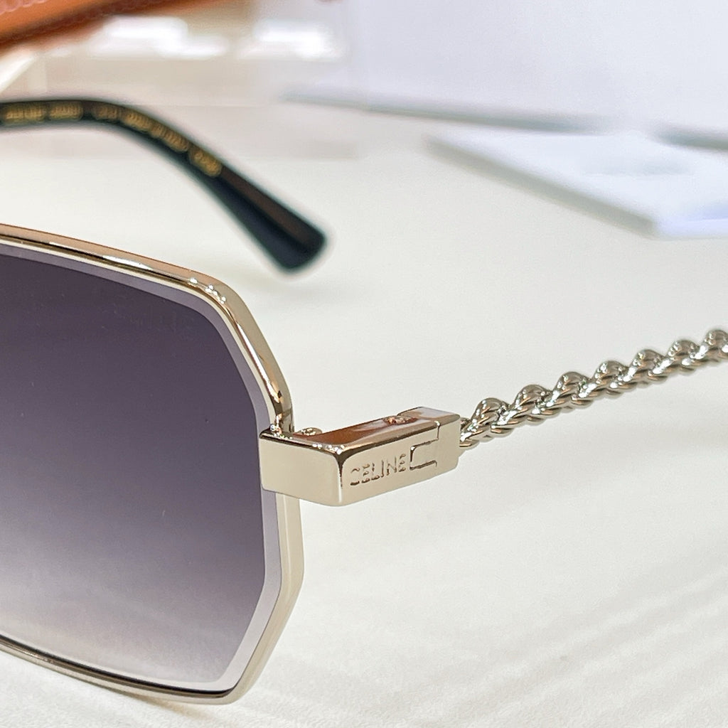 Gold-tone sunglasses hinge with Celine logo and chain temple detail