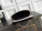 Black quilted mini handbag open with gold zipper and chain shoulder strap