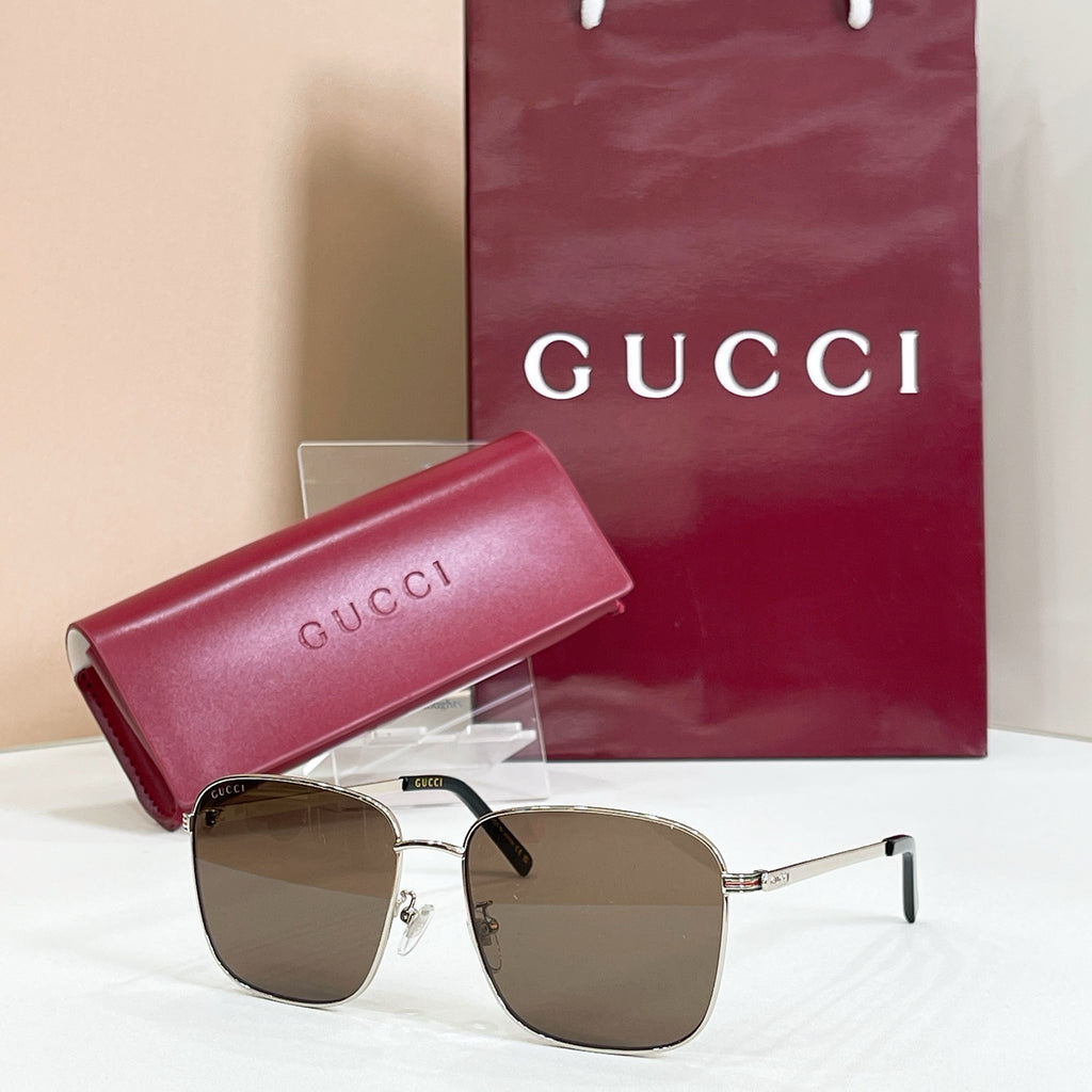 Square sunglasses with silver frame and brown-tinted lenses, with pink logo case