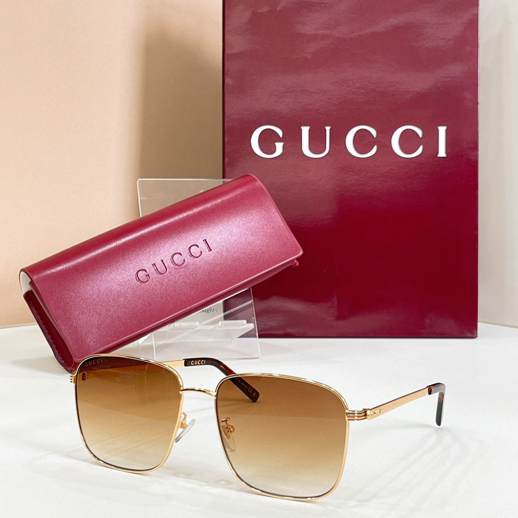 Square sunglasses with gold frame and amber lenses, with pink logo case