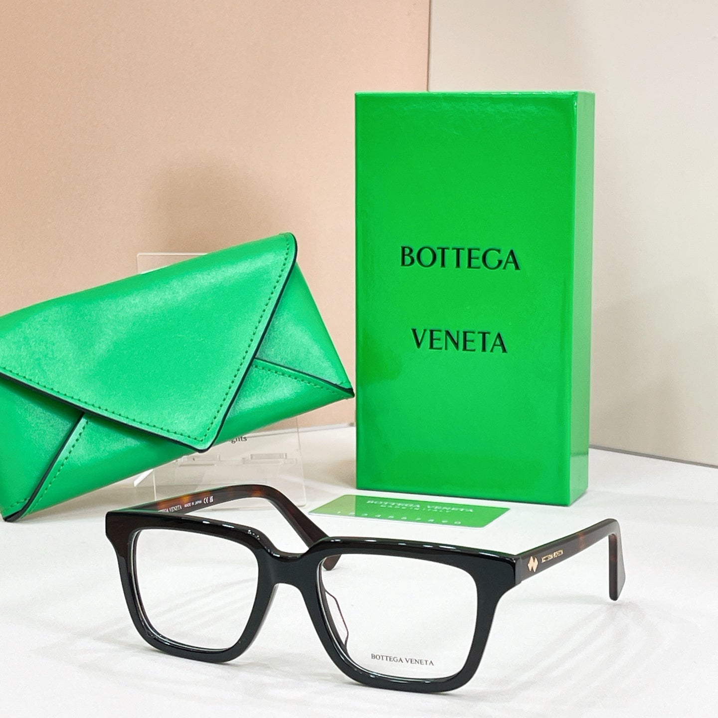 Eyeglasses with dark tortoiseshell frames and clear lenses, front angle