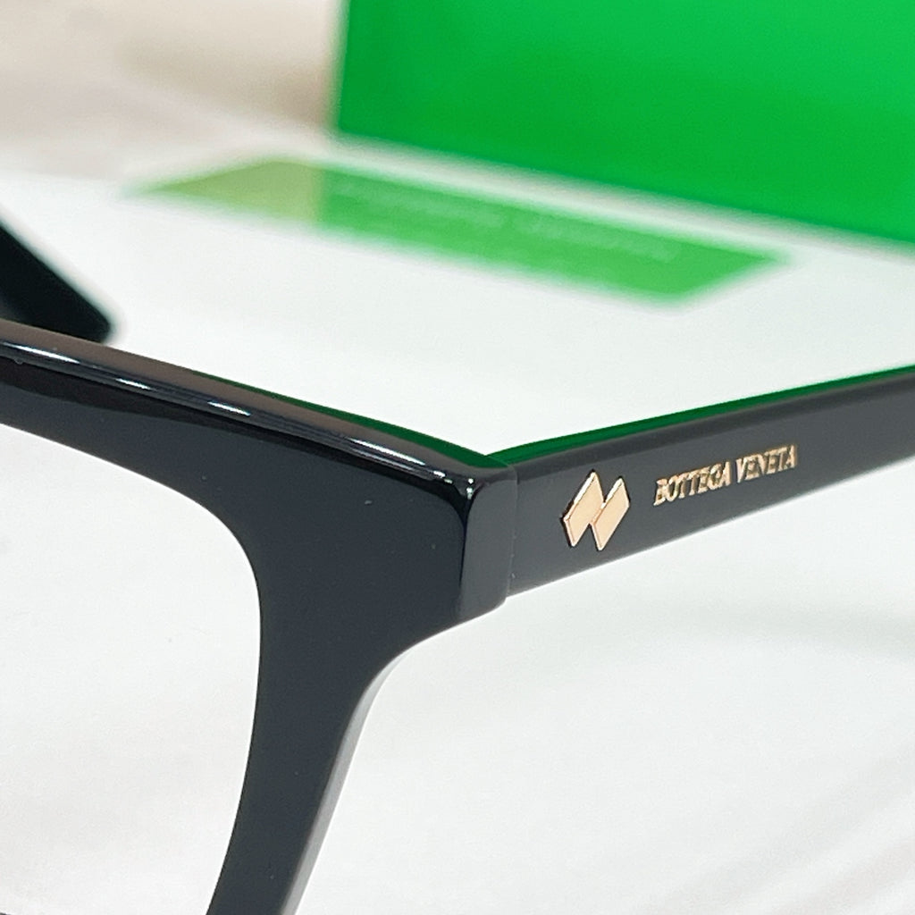 Eyeglasses temple with logo detail on black frame