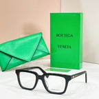 Eyeglasses with black frames and clear lenses, side angle