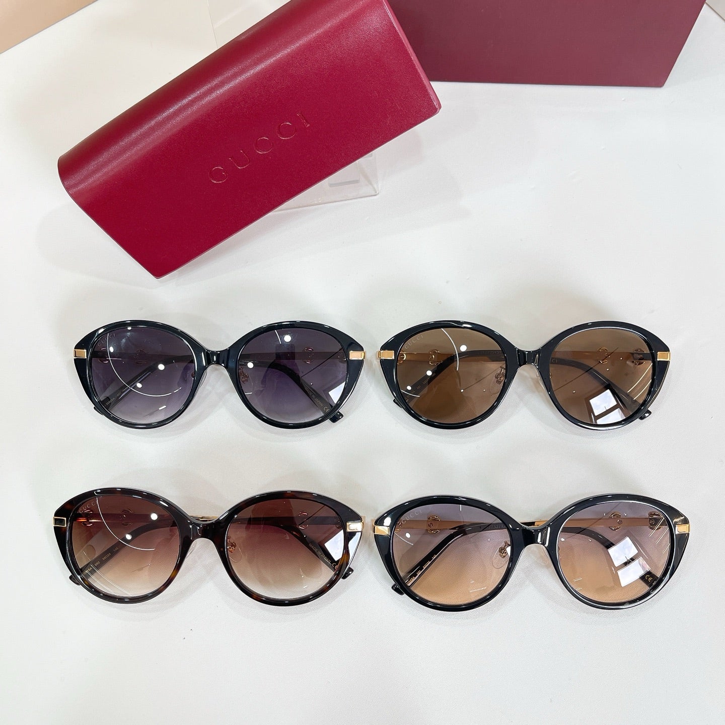 Four round sunglasses with black frames and mixed tinted lenses