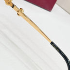 Gold-tone sunglasses temple with black inset and Gucci branding