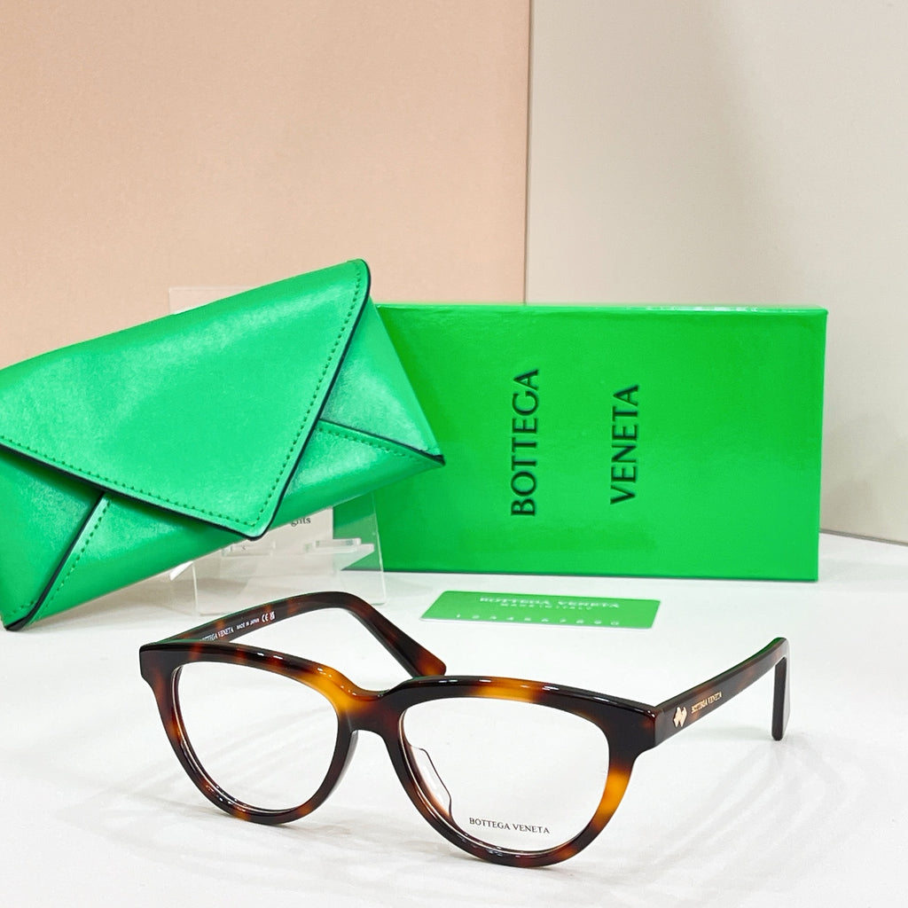 Tortoiseshell rectangular eyeglasses with clear lenses, Bottega Veneta logo on temples.