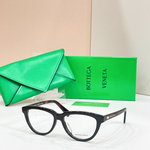 Black rectangular eyeglasses with clear lenses, Bottega Veneta logo on temples.
