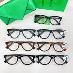 Assorted Bottega Veneta eyeglasses with clear lenses in black, tortoiseshell, and green frames.