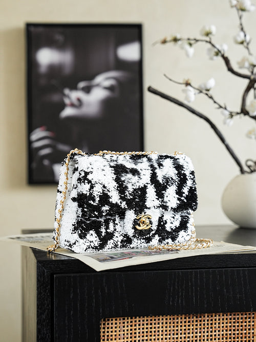Black-and-white sequin shoulder bag, front flap with gold logo clasp