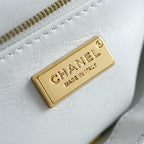 White Chanel fabric tag with gold 'CHANEL' and 'MADE IN FRANCE' label