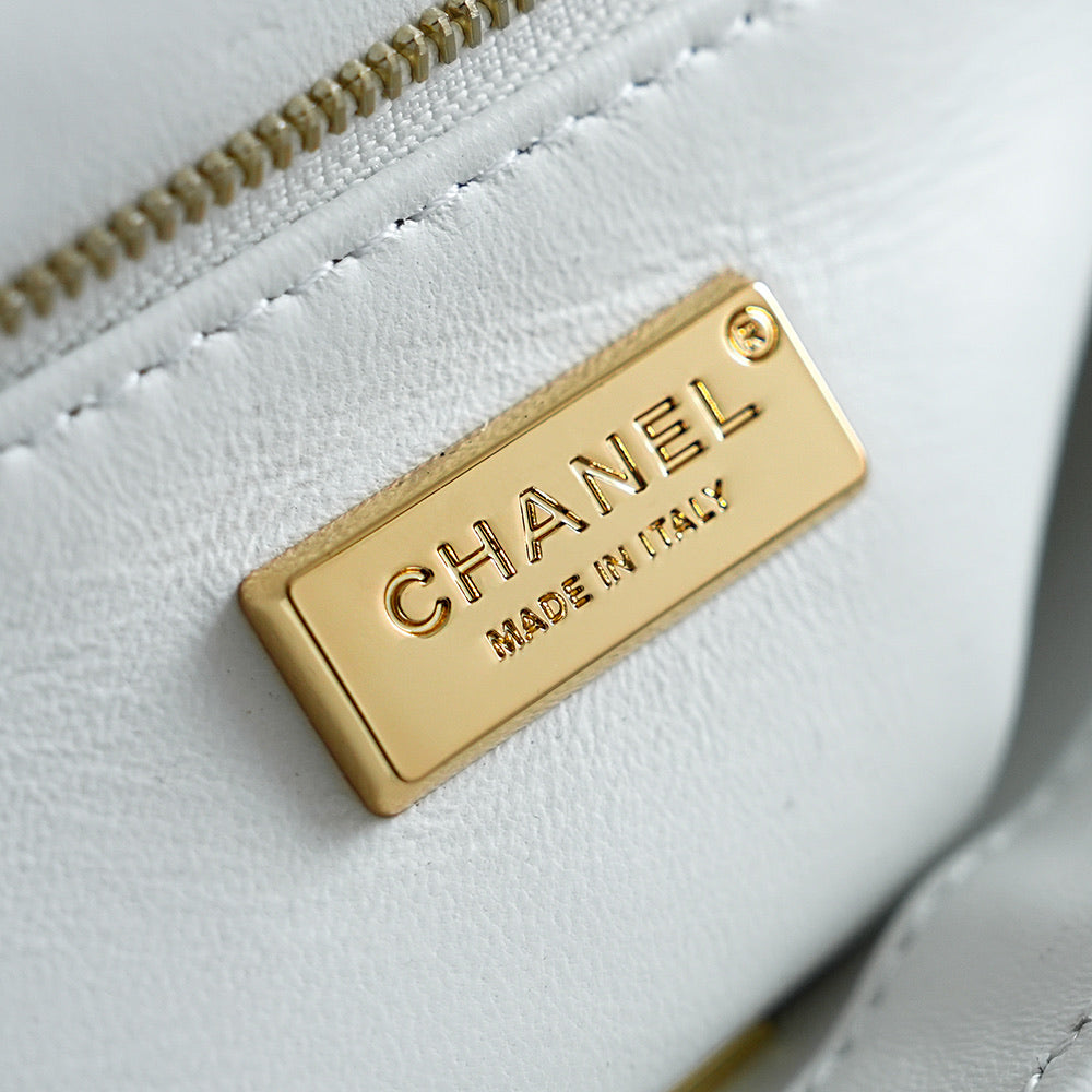 White Chanel fabric tag with gold 'CHANEL' and 'MADE IN FRANCE' label