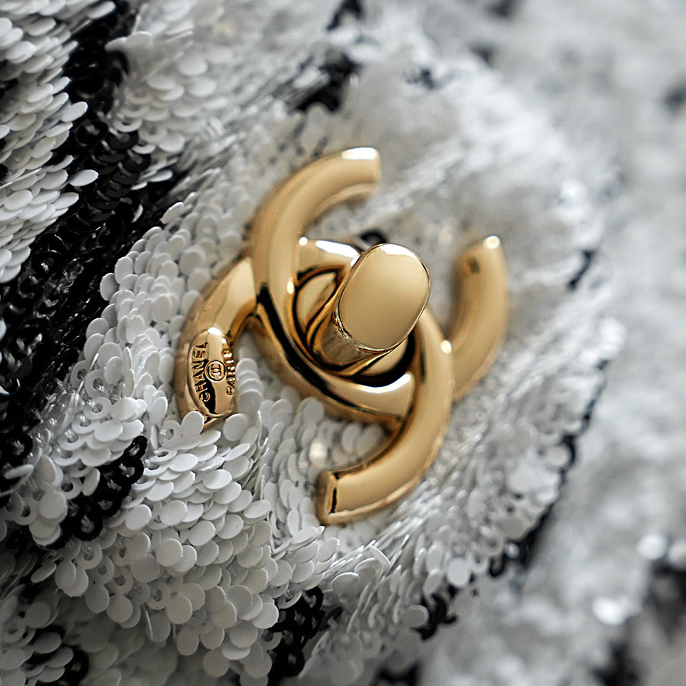 Chanel gold-tone hardware and chain detail on white sequined tweed bag