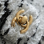 Chanel gold-tone hardware and chain detail on white sequined tweed bag