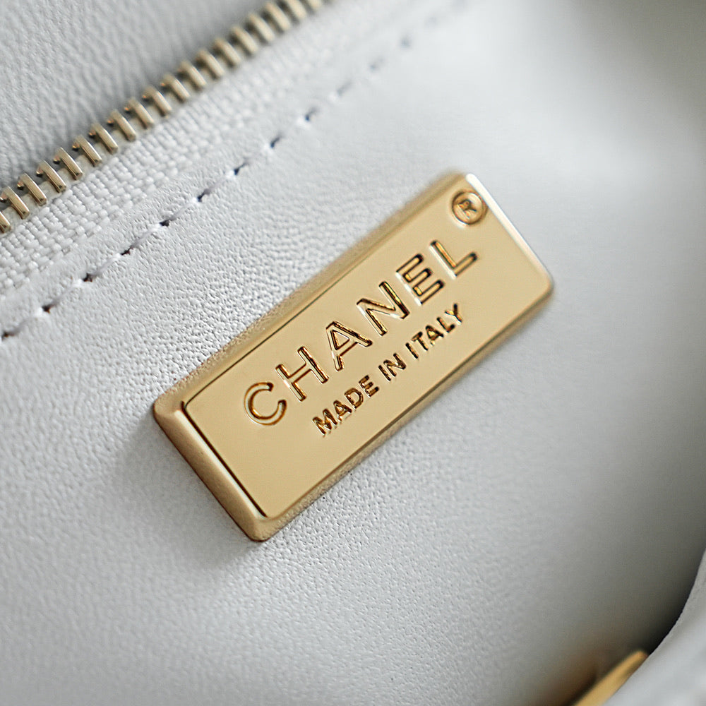 Chanel Paris Made in Italy gold tag on white fabric with zipper edge