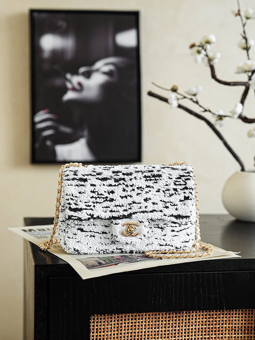 Chanel tweed flap bag with chain strap, white with black speckles, gold clasp