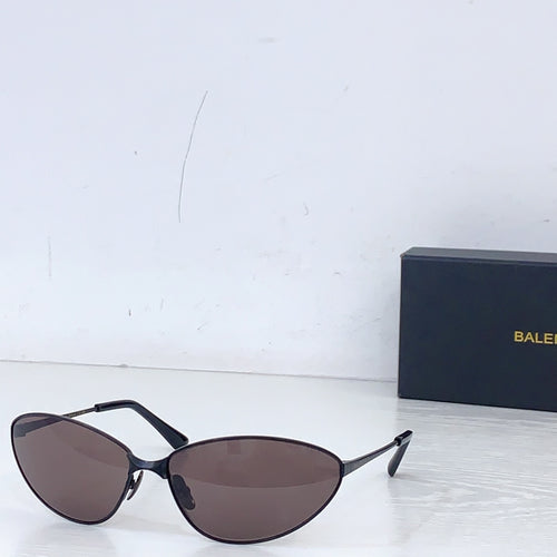 Sunglasses with dark frames and dark brown tinted lenses, oval cat-eye style.