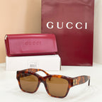 Gucci cat-eye sunglasses with tortoiseshell frame and brown-tinted lenses