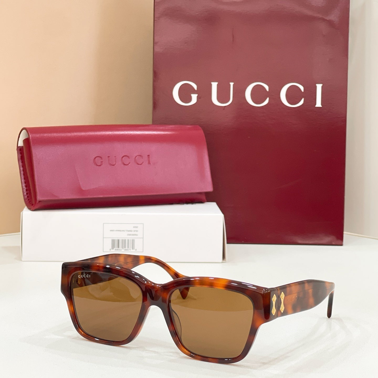 Gucci cat-eye sunglasses with tortoiseshell frame and brown-tinted lenses