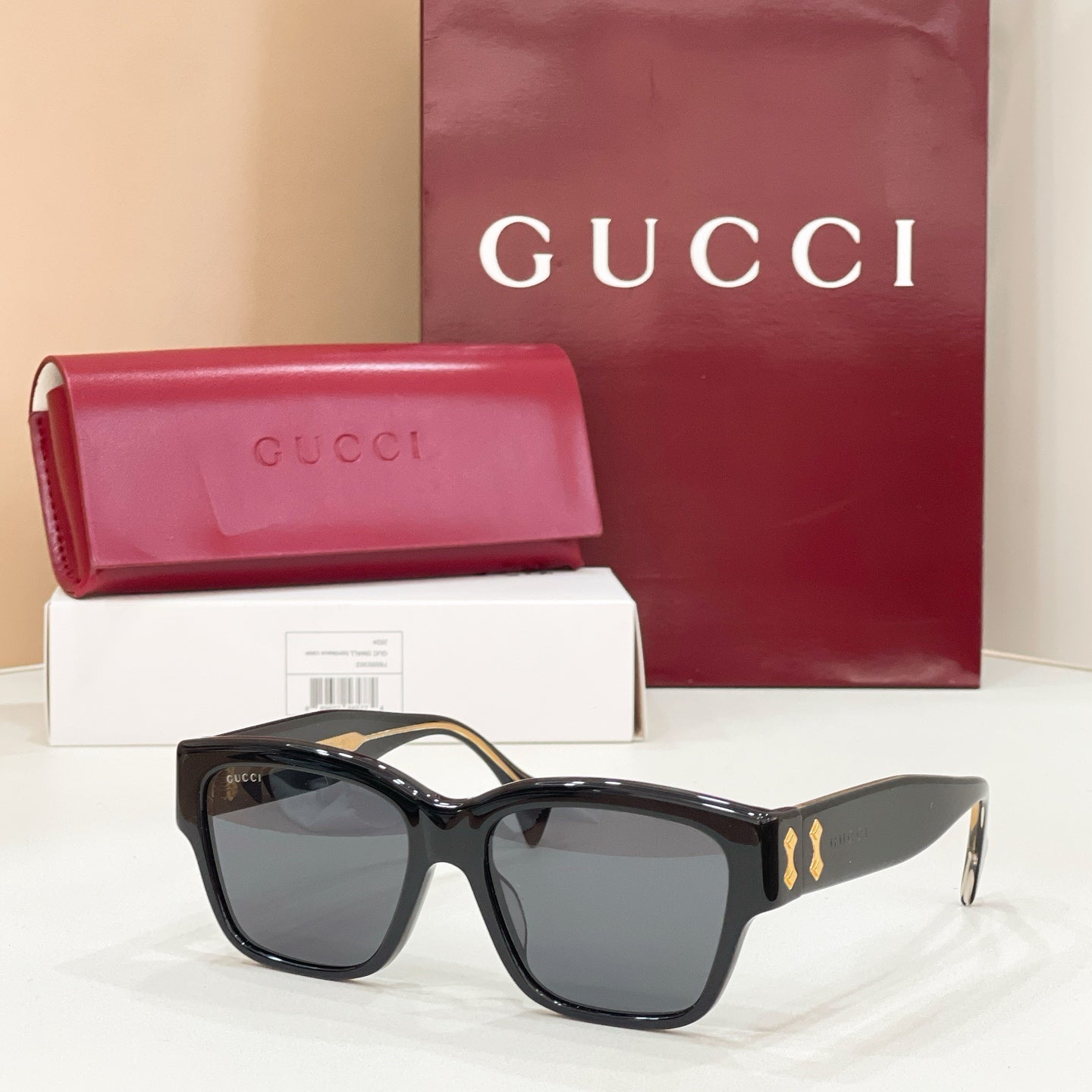 Gucci cat-eye sunglasses with black frame and smoke gray lenses