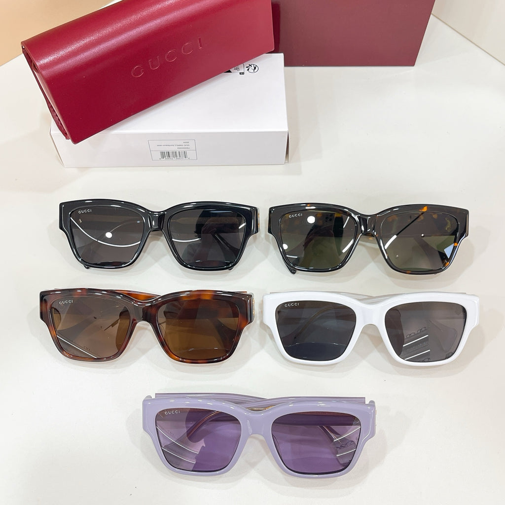 Set of Gucci cat-eye sunglasses with black, tortoiseshell, white, and lavender frames