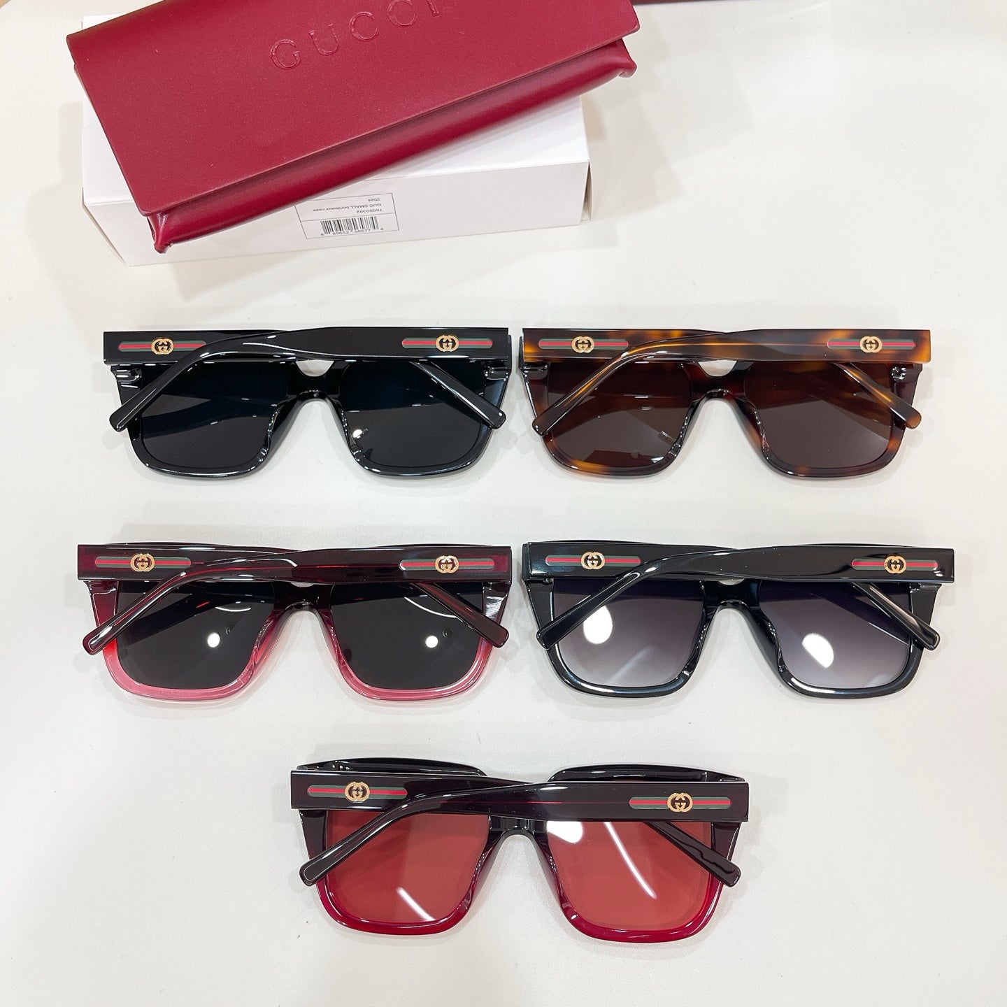Set of five square sunglasses with tinted lenses in black, tortoise, and burgundy frames