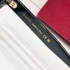 Black sunglasses temple text 'GUCCI MADE IN ITALY' with small size code.