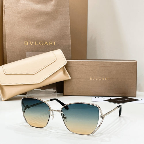 Gold-tone sunglasses with dark blue gradient lenses and thin metal frame