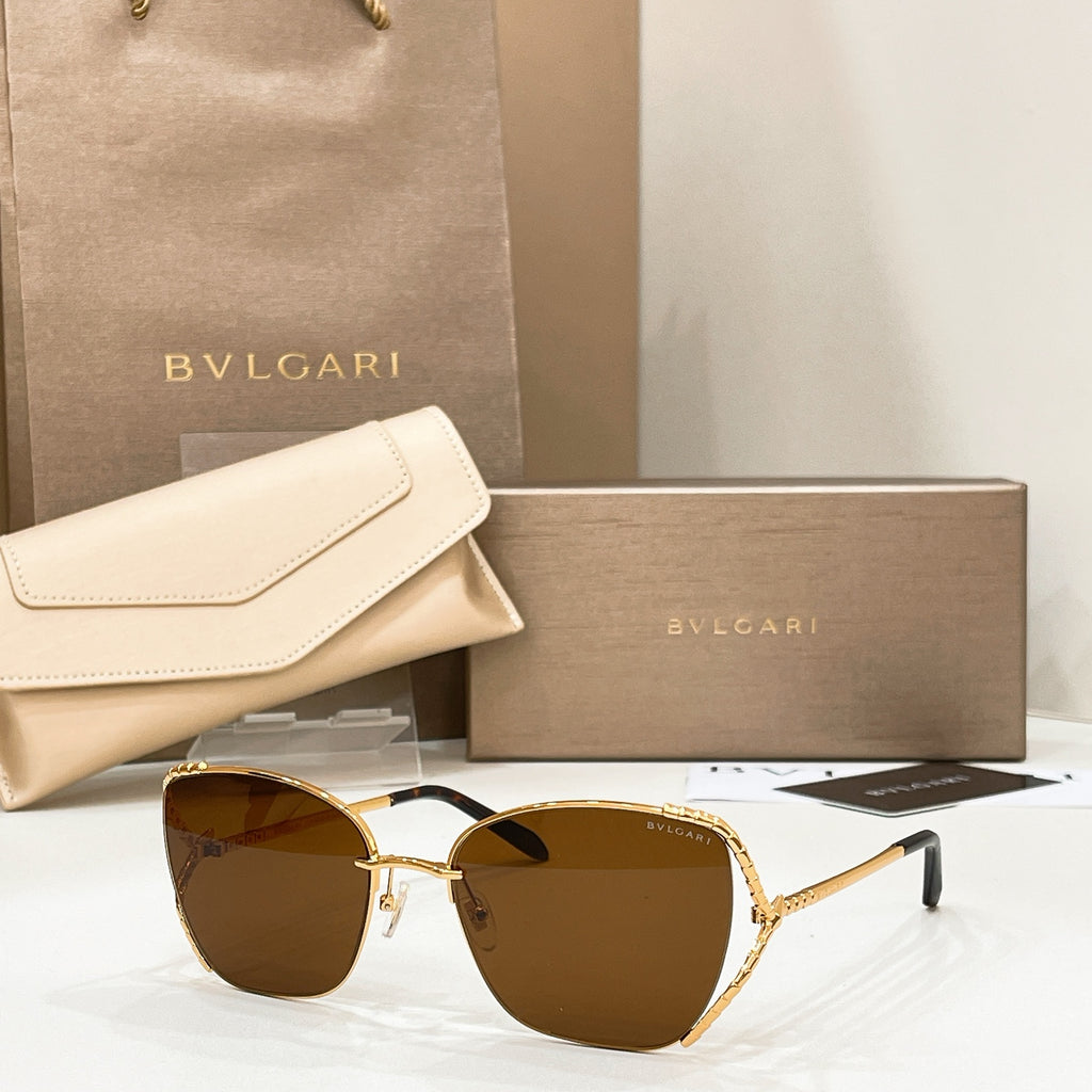 Gold-tone sunglasses with warm brown lenses and slim metal frame