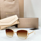 Gold-tone sunglasses with warm brown lenses and thin metal frame
