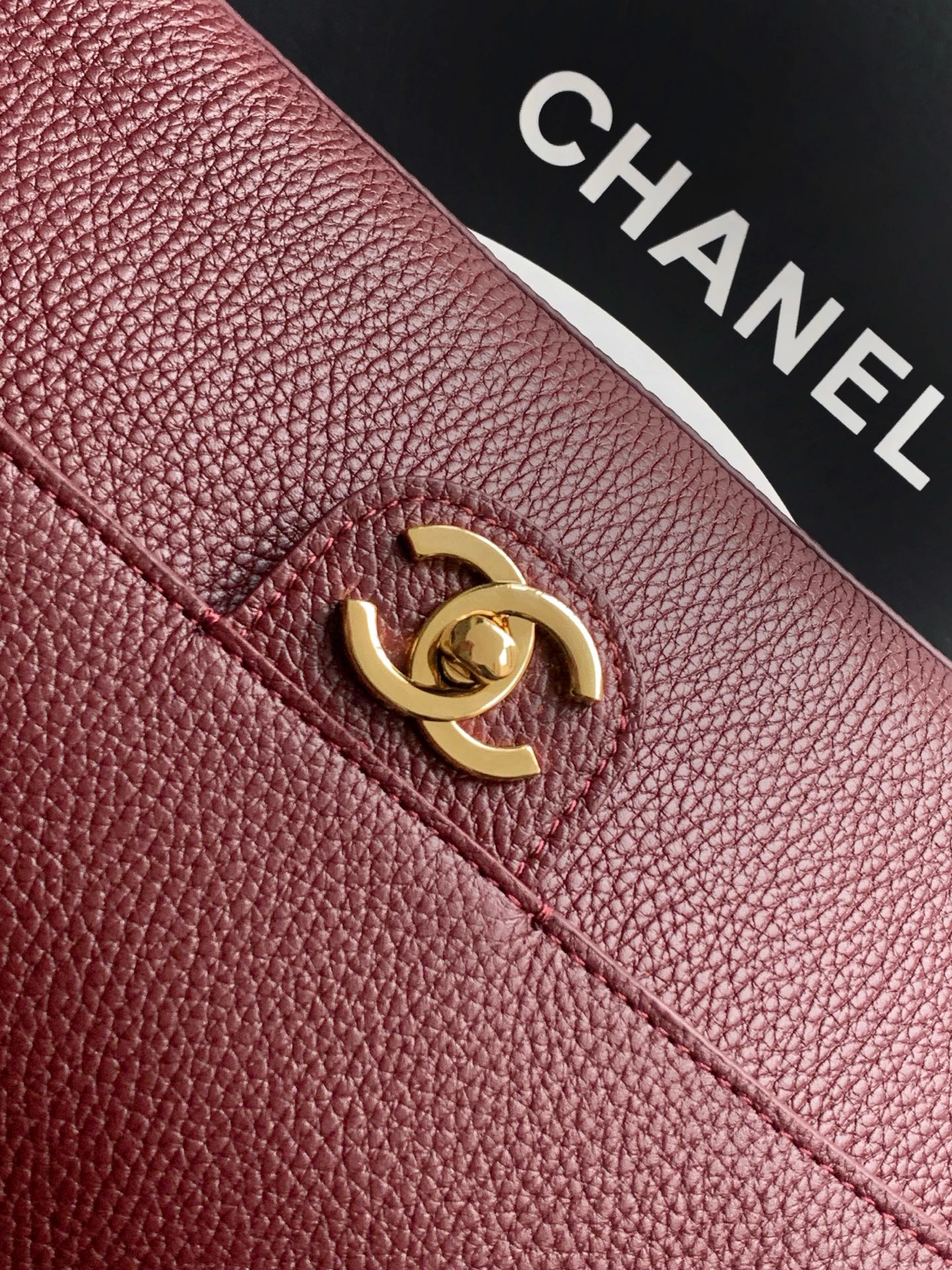 Chanel logo turn-lock on burgundy textured leather flap