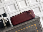 Chanel shoulder bag in burgundy textured leather with gold-tone top clasp