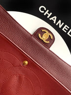 Chanel CC emblem on burgundy textured leather with stitched pocket