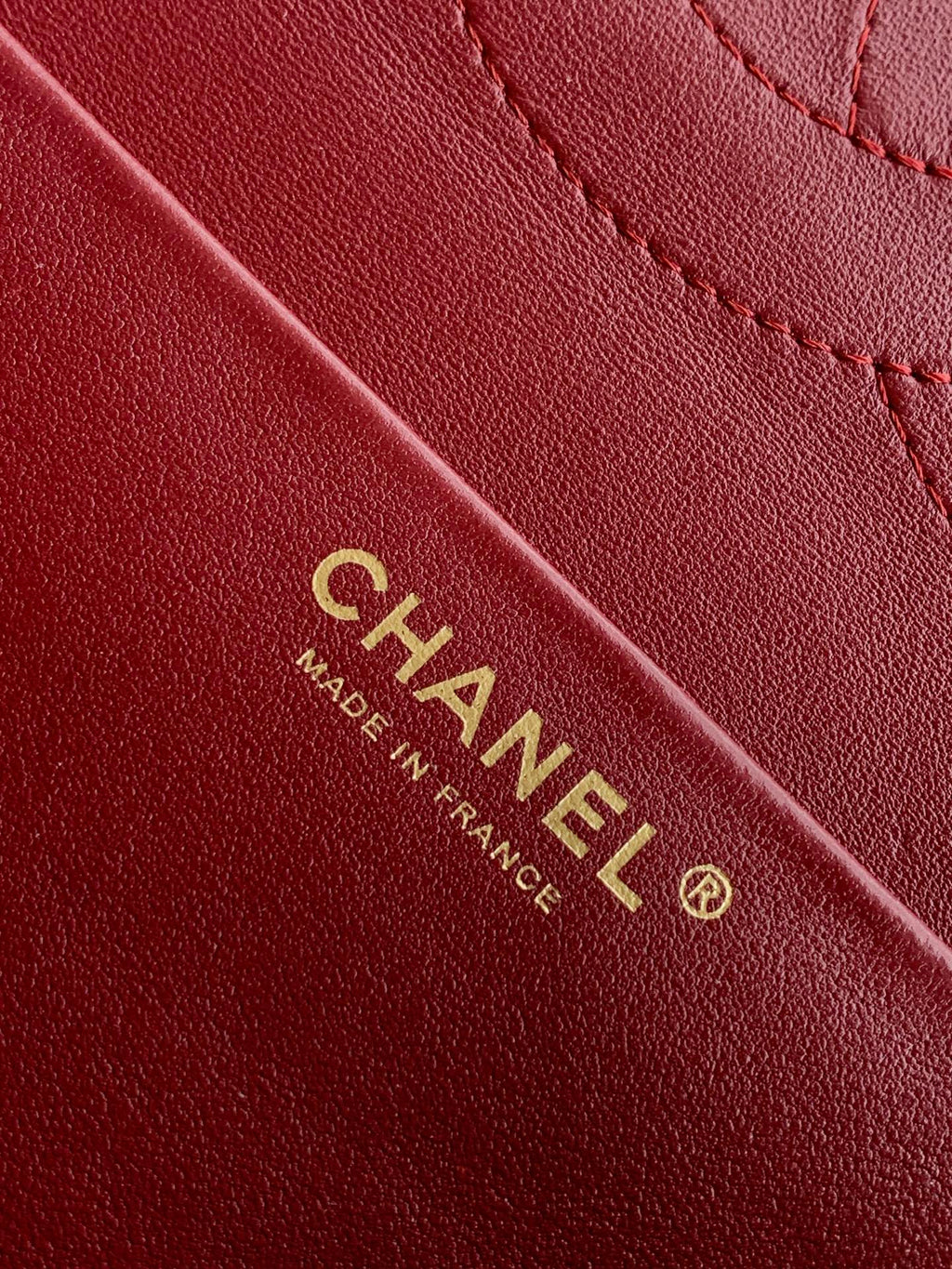Chanel Made in France label on burgundy leather strap