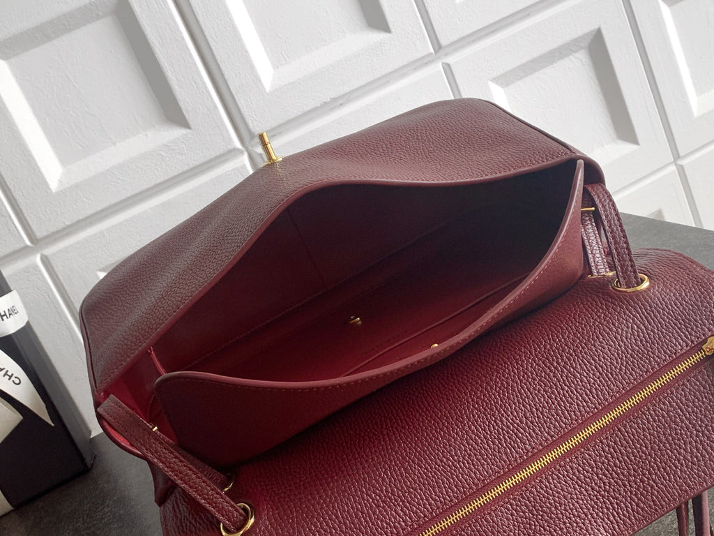 Chanel burgundy textured leather bag open, showing interior lining