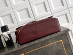 Burgundy leather shoulder bag with flap and gold-tone hardware