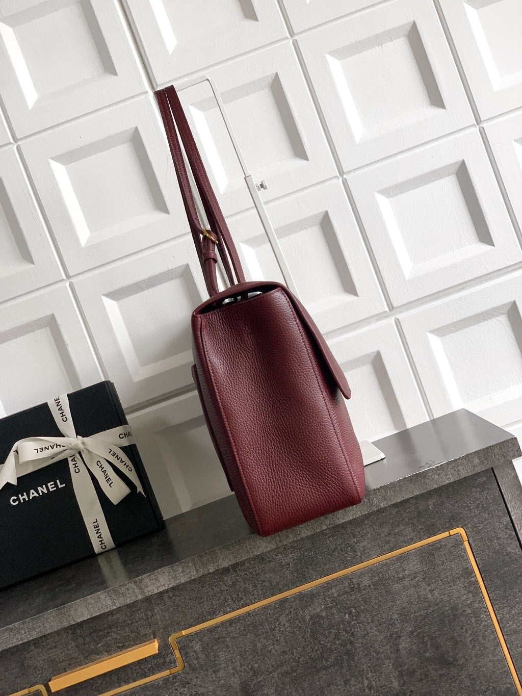 Burgundy leather shoulder bag with structured shape and top handles