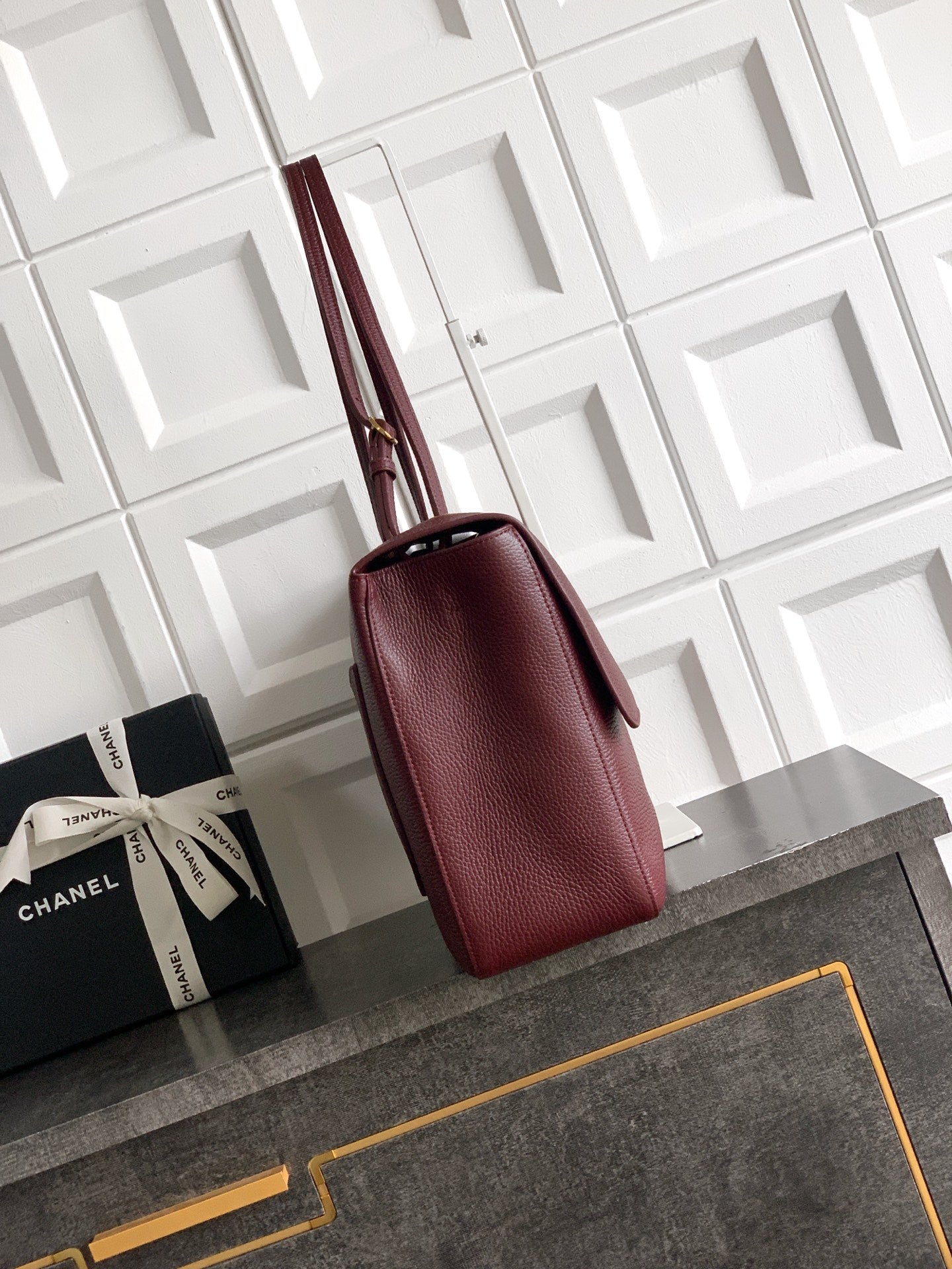 Burgundy leather shoulder bag with structured shape and top handles