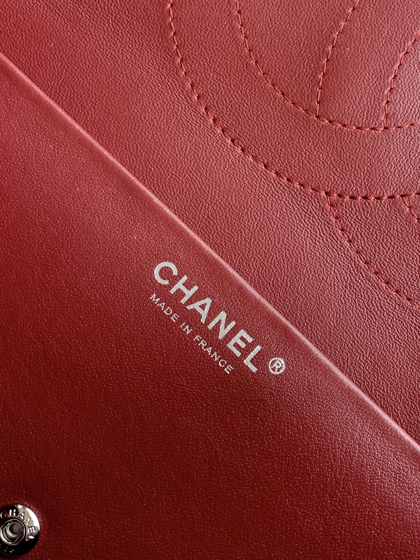 Burgundy Chanel bag with CHANEL and MADE IN FRANCE stamp on leather.