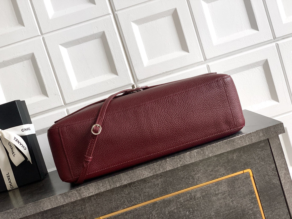 Chanel leather bag in maroon with long flap and silver-tone hardware detail