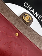 Chanel bag interior pocket in red leather with gold snap button and stitching