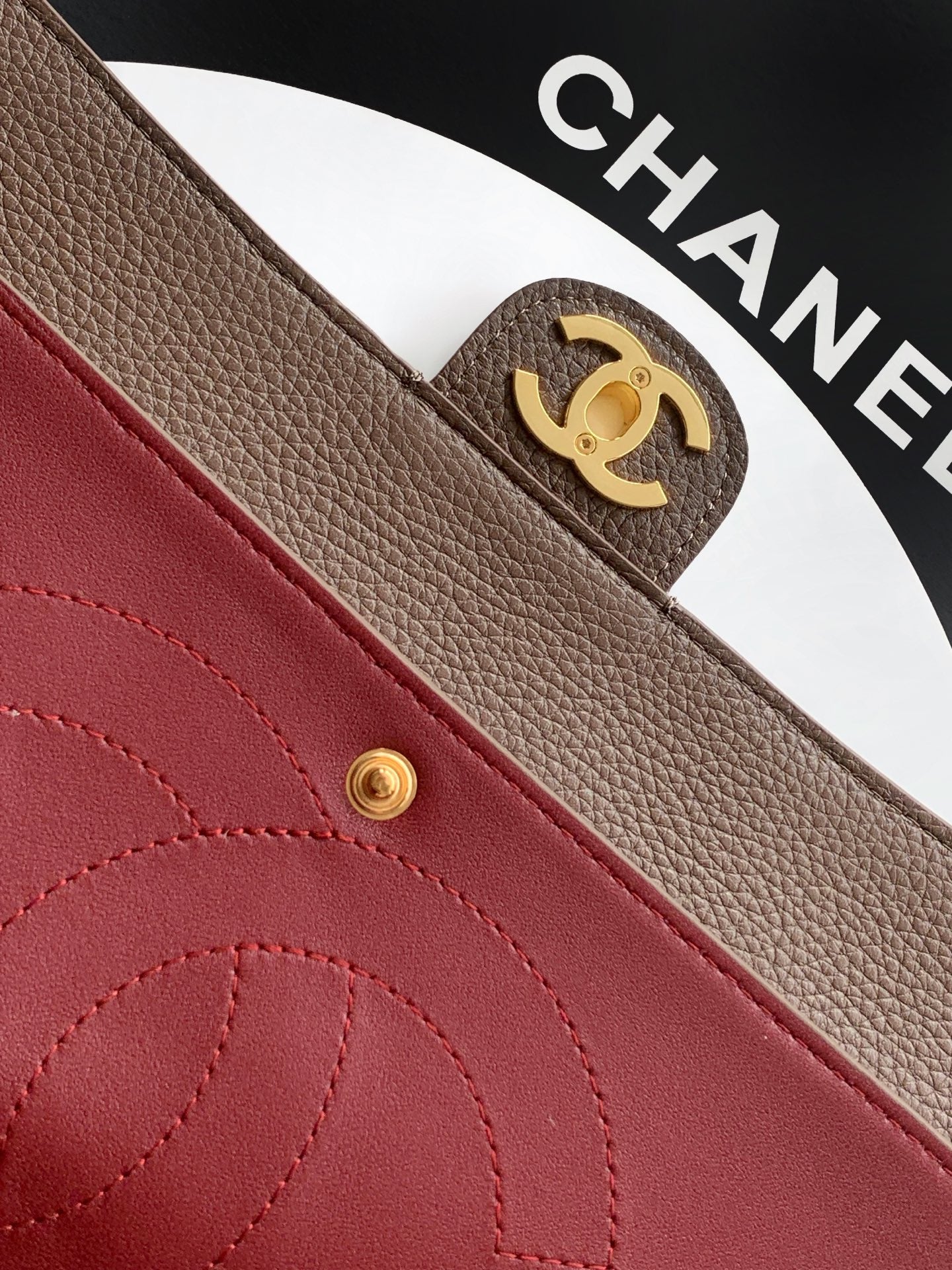 Chanel bag interior pocket in red leather with gold snap button and stitching