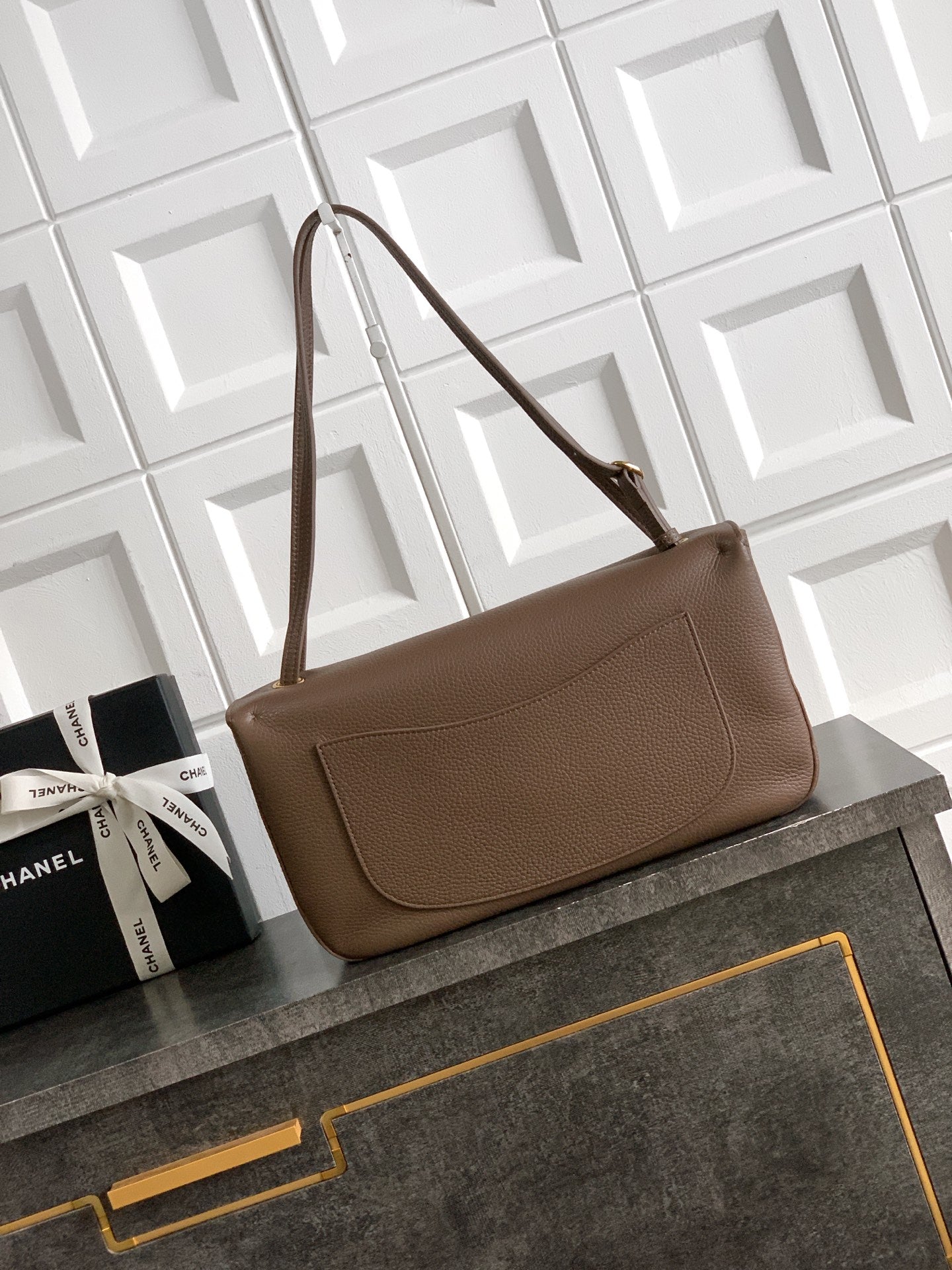 Chanel shoulder bag in taupe leather with front flap and gold turn-lock hardware