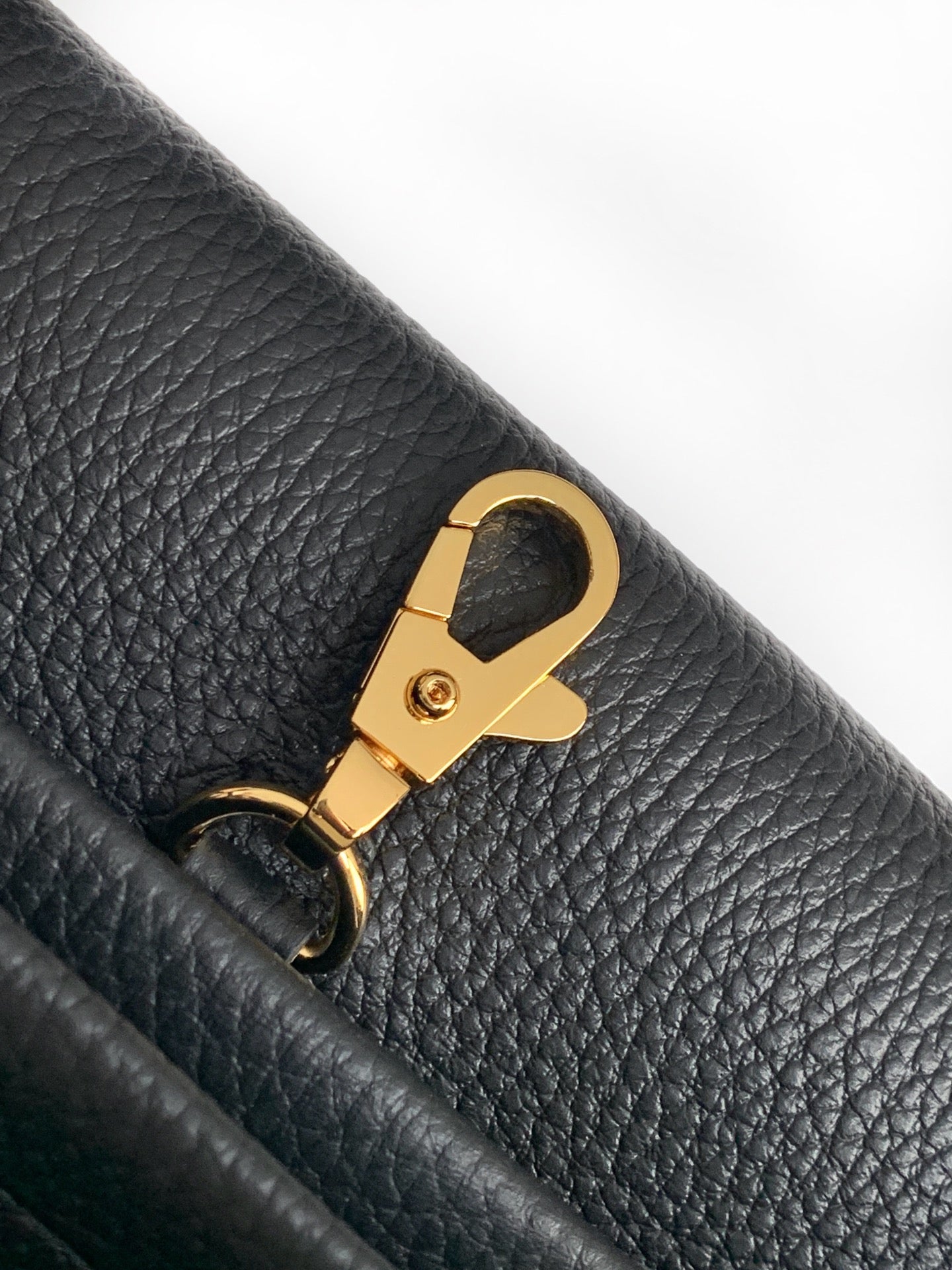 Black leather strap detail with gold Chanel keyring clasp