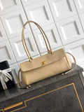 Beige Chanel leather handbag with top handles, gold-tone clasp and shoulder strap