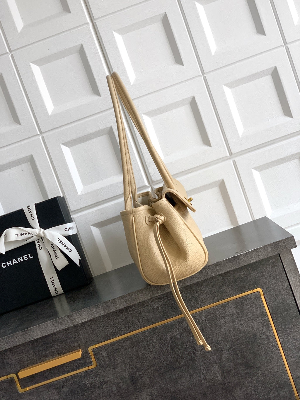 Beige Chanel leather handbag with short top handles and long shoulder strap, gold hardware
