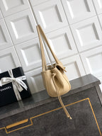 Beige Chanel leather handbag with short top handles and long shoulder strap, gold hardware