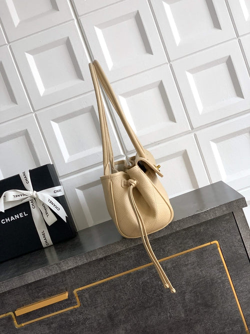 Beige Chanel leather handbag with short top handles and long shoulder strap, gold hardware