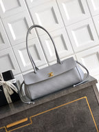 Chanel structured tote bag in light gray leather with gold CC clasp and top handles