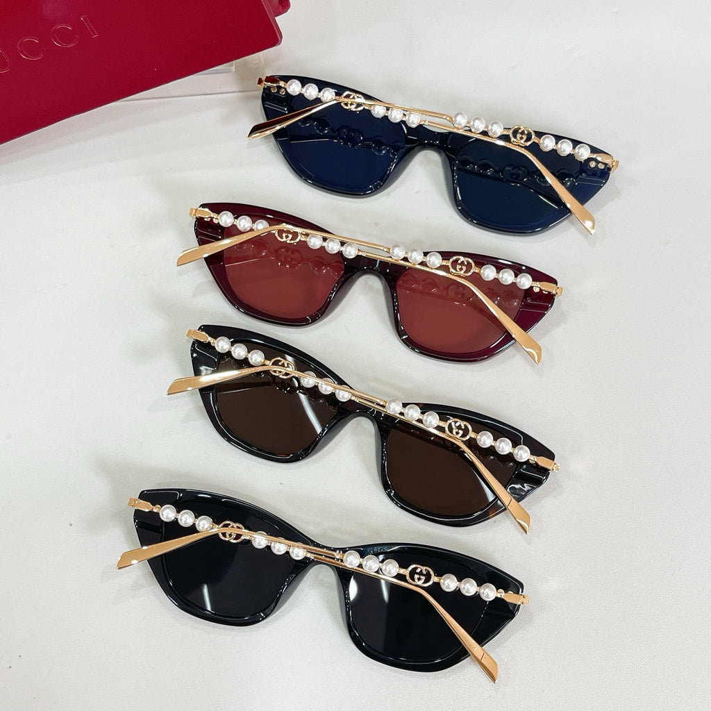 Set of four sunglasses with pearl-and-gold temple chains and dark tinted lenses