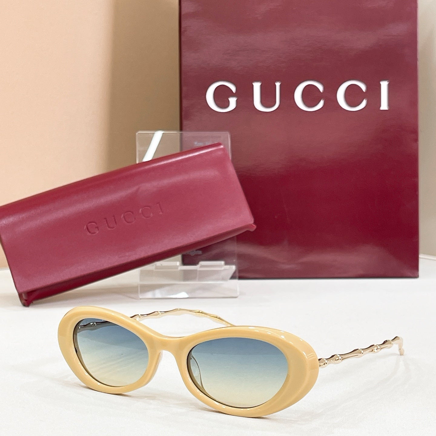 Gucci sunglasses, cream round frames with blue mirrored lenses and gold-tone arms